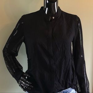 Black button up with skull buttons and mesh arms.